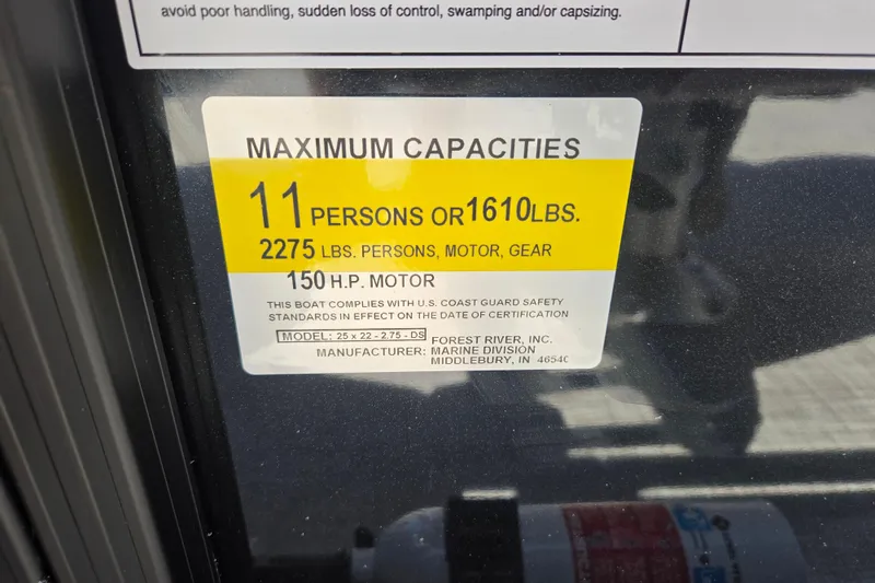 Slide: The Image of Maximum capacity label for Dockside 22DQ275 boat, 2026 model, 11 persons or 1610 lbs. - 22