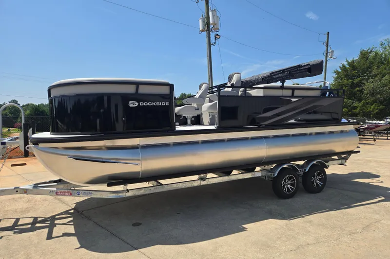 Slide: The Image of 2026 Dockside 22DQ275 pontoon boat on trailer, sleek design, sunny day. - 2
