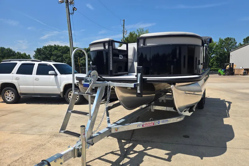 Slide: The Image of 2026 Dockside 22DQ275 pontoon boat on trailer, parked beside a white SUV. - 21