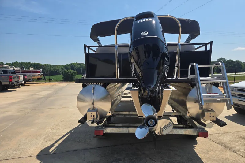 Slide: The Image of Rear view of a 2026 Dockside 22DQ275 pontoon boat with powerful outboard motor. - 15