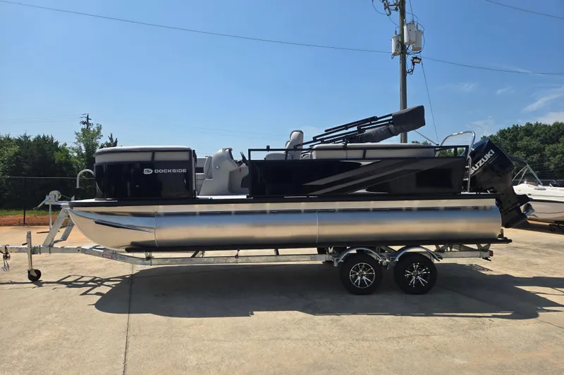 The Image of 2026 Dockside 22DQ275 pontoon boat on trailer, parked outdoors. - 1