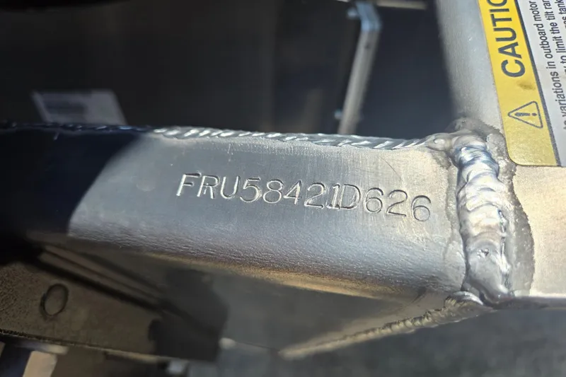 Slide: The Image of Close-up of Dockside 22DQ275 metal frame with serial number FRU58421D626, year 2026. - 19
