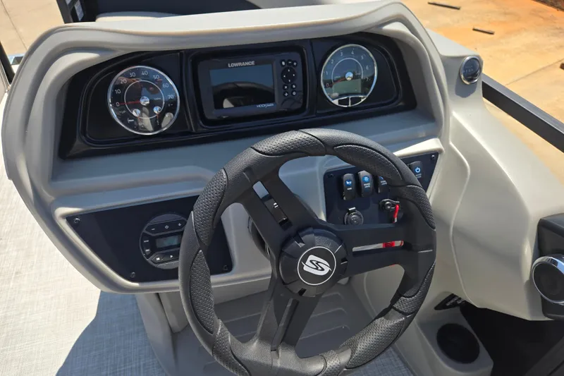 Slide: The Image of Steering console of 2026 Dockside 22DQ275 boat with modern gauges and controls. - 8