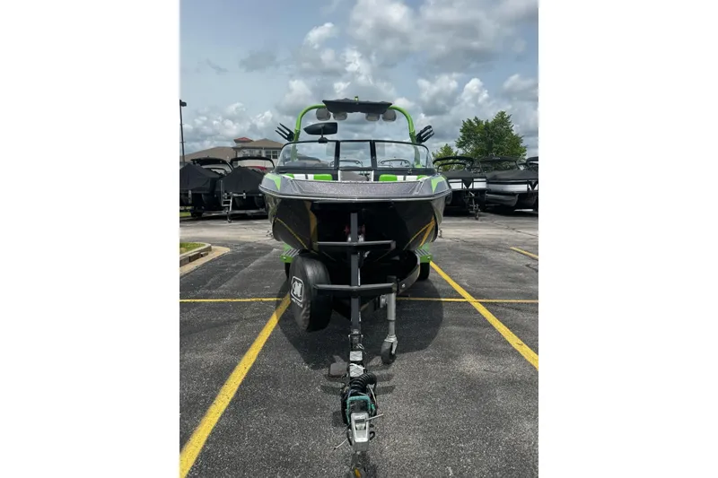 Slide: The Image of 2014 Nautique Super Air Nautique G21 boat on trailer in parking lot. - 3