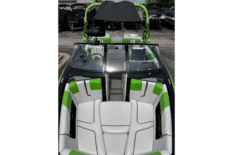 Slide: The Image of 2014 Nautique Super Air Nautique G21 boat interior with green and white seating. - 26