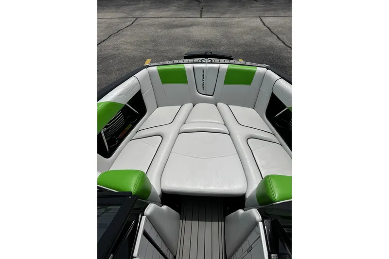 Slide: The Image of 2014 Nautique Super Air Nautique G21 boat interior with white and green seating. - 23