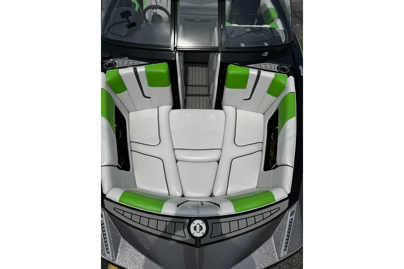 Slide: The Image of 2014 Nautique Super Air Nautique G21 boat interior with green and white seating. - 25
