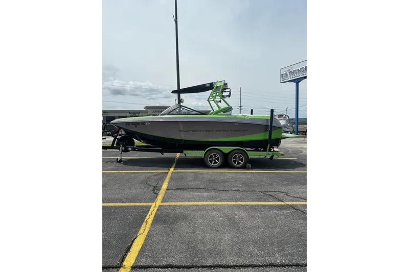 Slide: The Image of 2014 Nautique Super Air Nautique G21 boat on trailer in parking lot. - 5