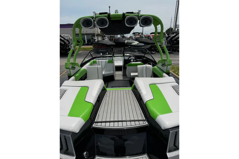 Slide: The Image of 2014 Nautique Super Air Nautique G21 boat interior with green and white seating. - 9