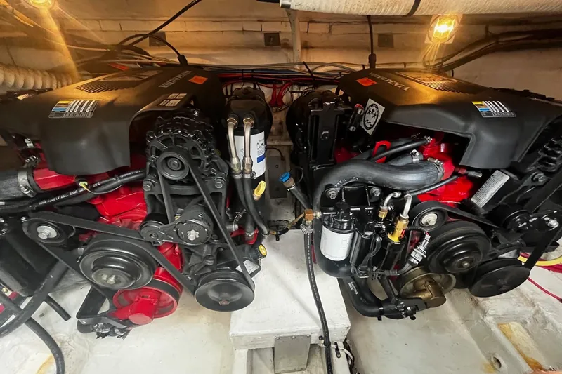 Slide: The Image of Engine compartment of a 2004 Cruisers Yachts 280 CXi Express, showcasing dual engines. - 15