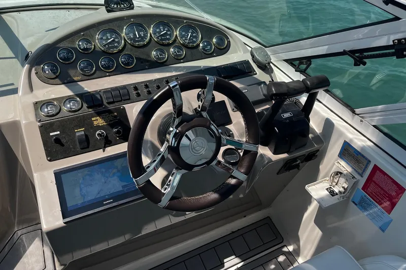Slide: The Image of Helm of 2004 Cruisers Yachts 280 CXi Express with gauges and navigation system. - 9