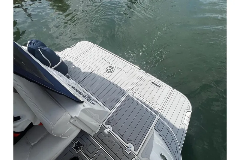 Slide: The Image of 2004 Cruisers Yachts 280 CXi Express swim platform on water. - 13