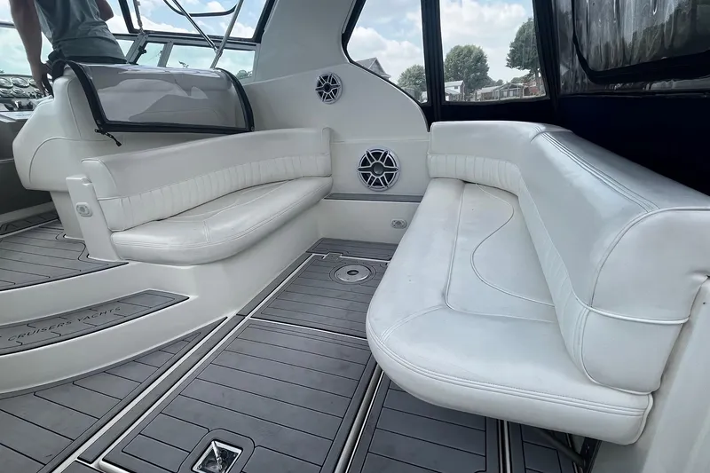 Slide: The Image of 2004 Cruisers Yachts 280 CXi Express interior with white seating and modern design. - 11