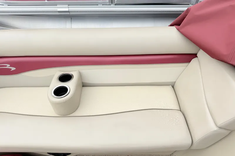 Slide: The Image of 2012 Bennington 20SLM boat seat with cup holders, featuring beige and red upholstery. - 6