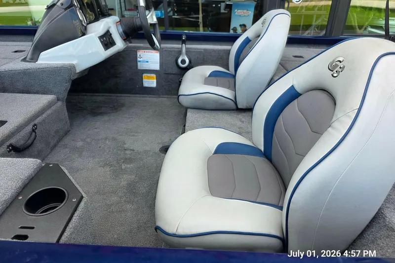 Slide: The Image of 2017 G3 Sportsman 18 boat interior with gray and blue seating. - 2