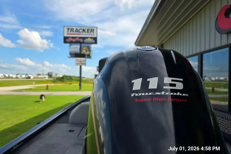 Slide: The Image of Outboard motor on a 2017 G3 Sportsman 18 boat near dealership, sunny day. - 6