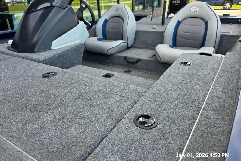 Slide: The Image of 2017 G3 Sportsman 18 boat interior with gray carpet and dual seats. - 5