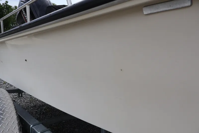 Slide: The Image of 1991 Boston Whaler 170 Montauk boat side view on trailer. - 37