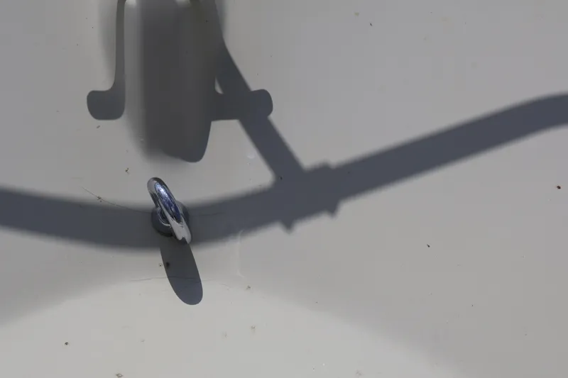 Slide: The Image of Close-up of a 1991 Boston Whaler 170 Montauk boat detail with shadow. - 18