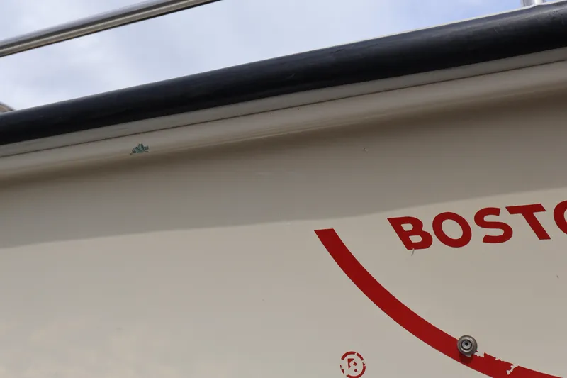 Slide: The Image of Close-up of a 1991 Boston Whaler 170 Montauk boat hull with logo detail. - 32