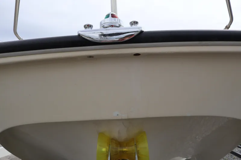 Slide: The Image of 1991 Boston Whaler 170 Montauk boat hull with navigation light and bow detail. - 41