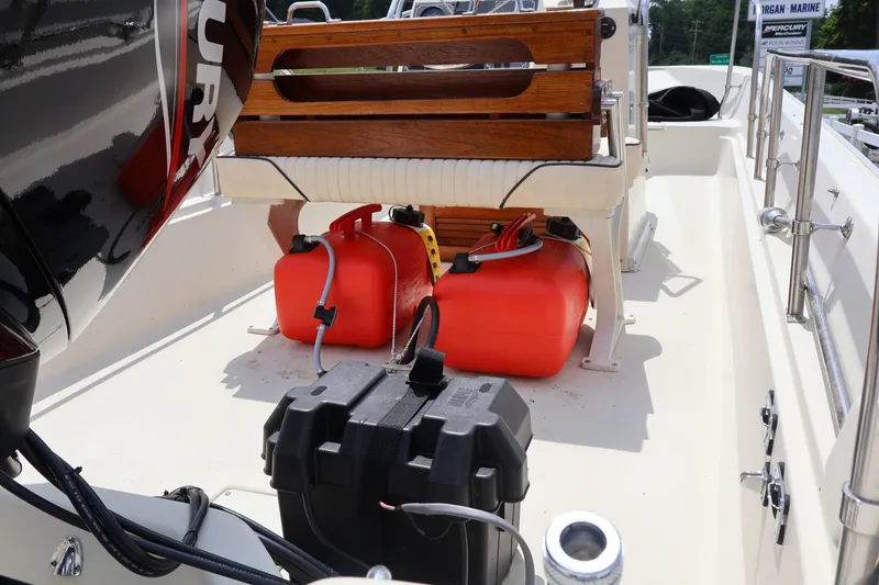 Slide: The Image of 1991 Boston Whaler 170 Montauk boat interior with fuel tanks and engine. - 8