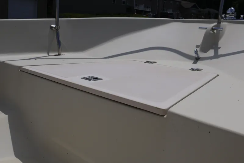 Slide: The Image of 1991 Boston Whaler 170 Montauk boat interior with storage compartment. - 19
