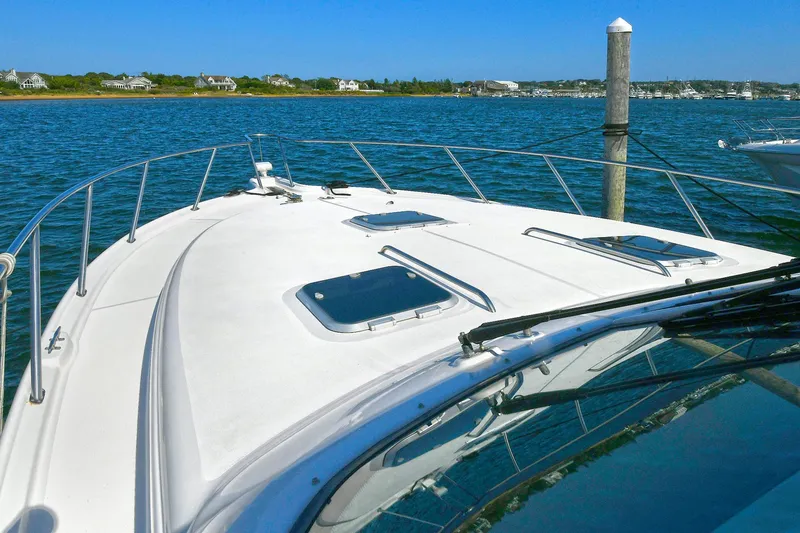 Slide: The Image of 2008 Tiara Yachts 4200 Open on calm water, showcasing sleek deck design. - 11