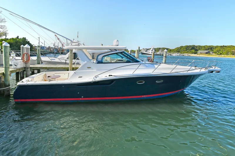 The Image of 2008 Tiara Yachts 4200 Open docked in a serene marina setting. - 0