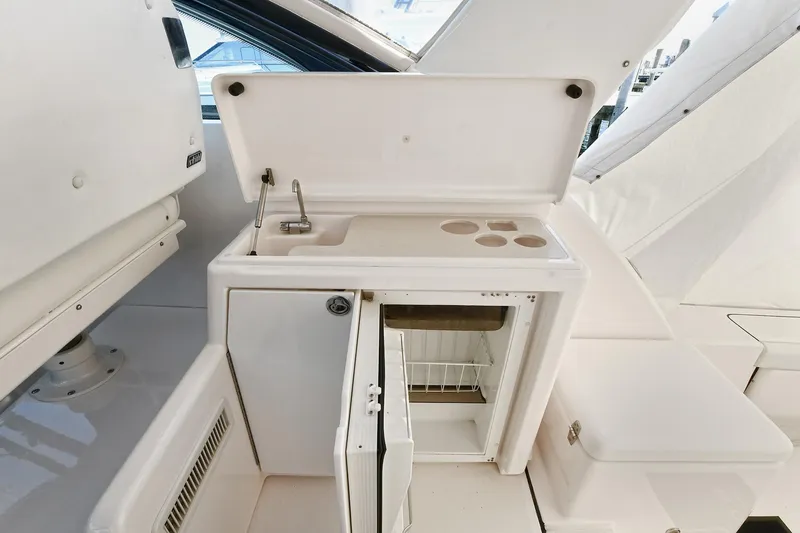 Slide: The Image of 2008 Tiara Yachts 4200 Open boat kitchenette with sink and mini fridge. - 19
