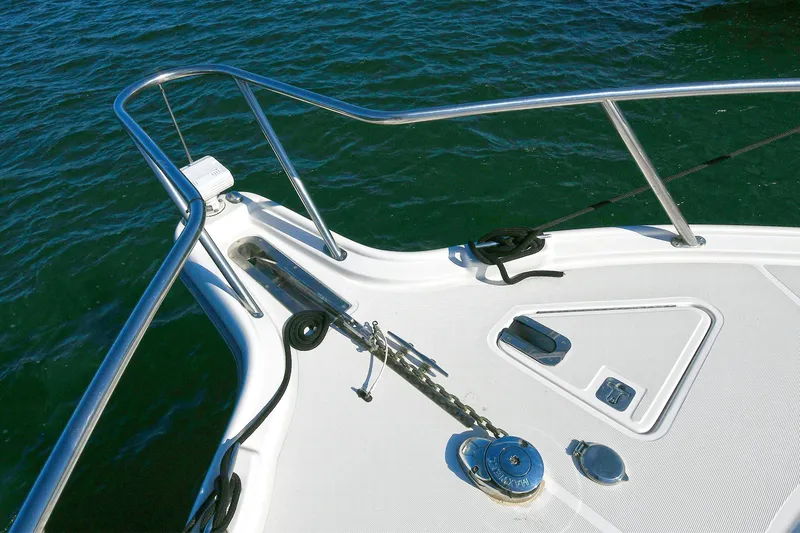 Slide: The Image of Bow of 2008 Tiara Yachts 4200 Open, featuring stainless steel railings and anchor system. - 12
