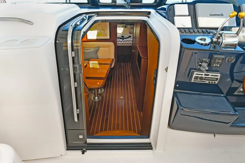 Slide: The Image of 2008 Tiara Yachts 4200 Open interior with wood flooring and seating area. - 26