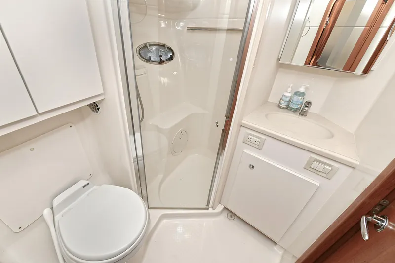 Slide: The Image of Bathroom interior of 2008 Tiara Yachts 4200 Open, featuring shower, toilet, and sink. - 43