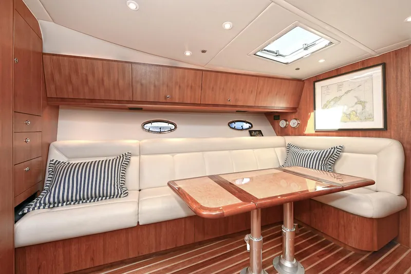 Slide: The Image of Luxurious interior of 2008 Tiara Yachts 4200 Open with elegant seating and wooden finishes. - 27