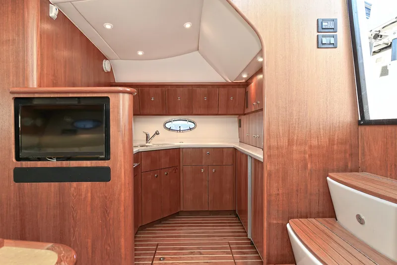 Slide: The Image of 2008 Tiara Yachts 4200 Open interior with wood finish and modern amenities. - 37