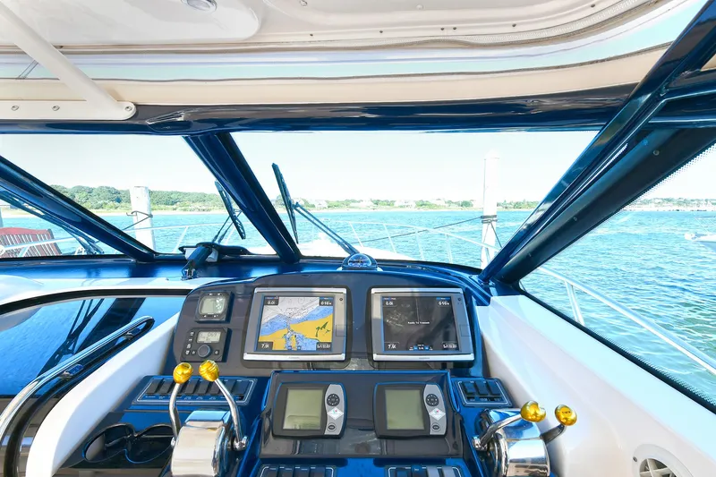 Slide: The Image of 2008 Tiara Yachts 4200 Open helm with navigation screens and ocean view. - 23
