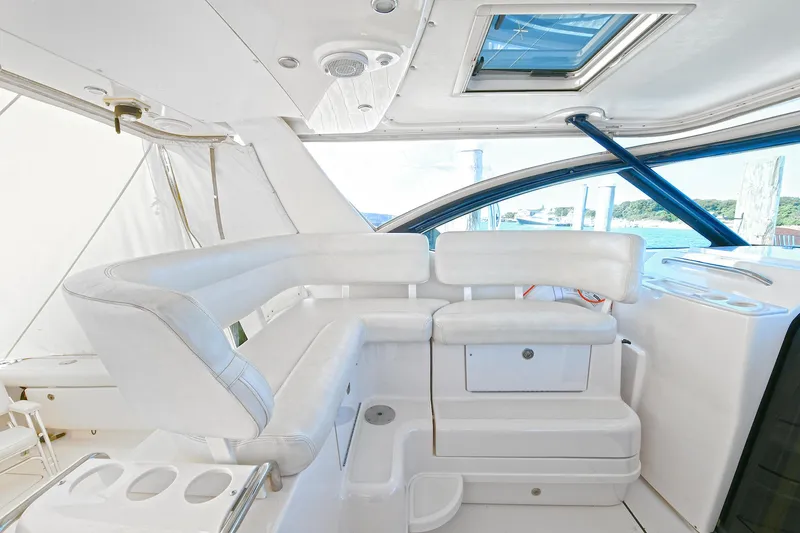 Slide: The Image of 2008 Tiara Yachts 4200 Open interior with white seating and skylight. - 20