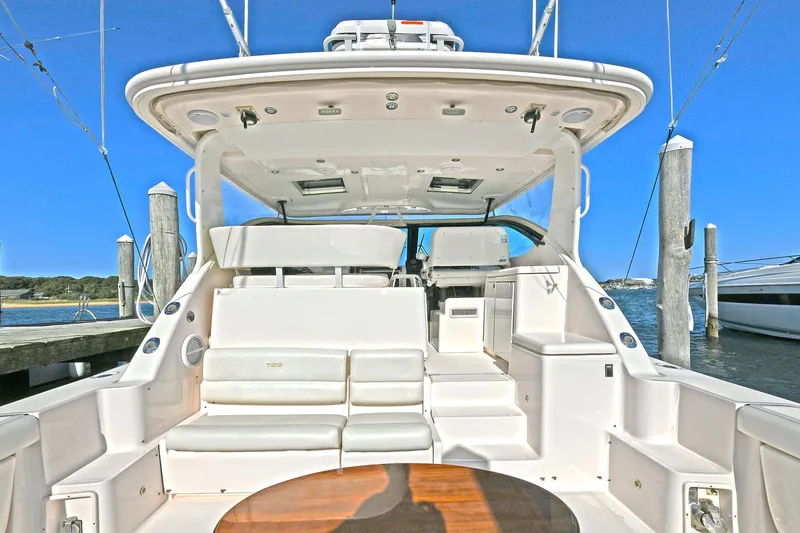 Slide: The Image of 2008 Tiara Yachts 4200 Open, spacious deck, luxury seating, docked at marina. - 5