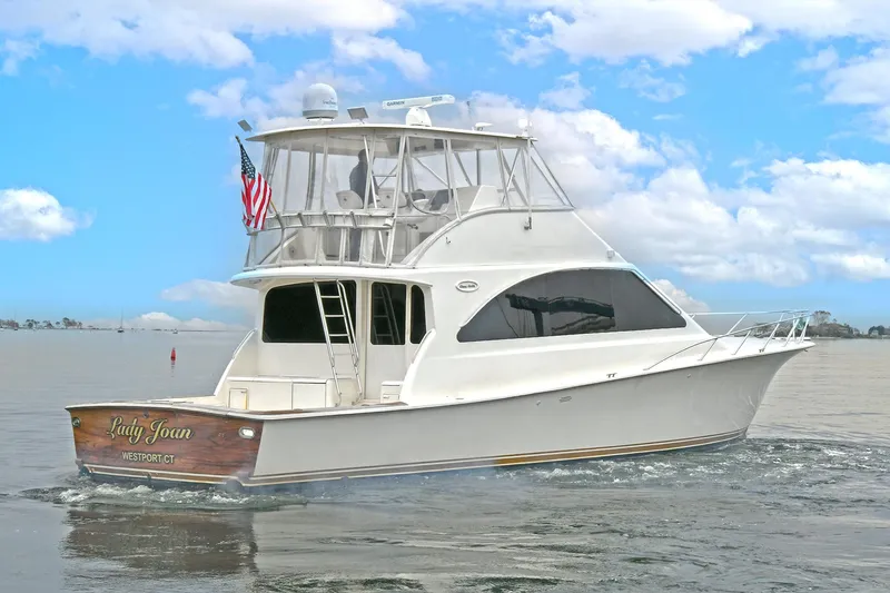 Slide: The Image of 2001 Ocean Yachts 52 Super Sport on calm waters. - 2