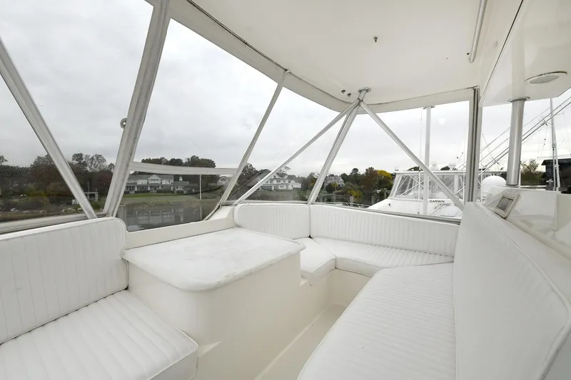 Slide: The Image of Interior of 2001 Ocean Yachts 52 Super Sport with white seating. - 22