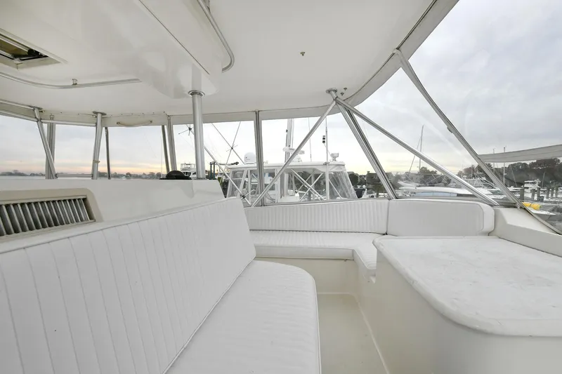 Slide: The Image of Interior of 2001 Ocean Yachts 52 Super Sport with white seating. - 23