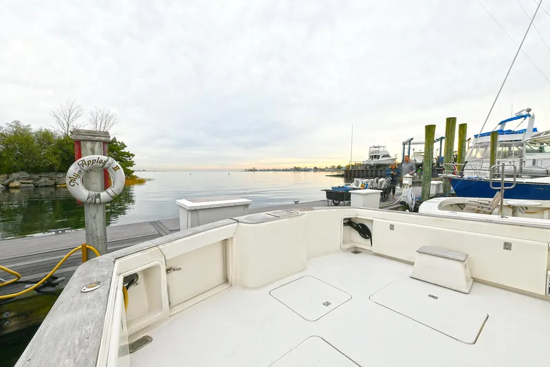 Slide: The Image of Ocean Yachts 52 Super Sport 2001 at dock with calm waters. - 11