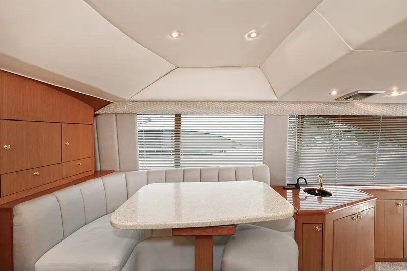 Slide: The Image of Interior of 2001 Ocean Yachts 52 Super Sport with dining table and seating area. - 39