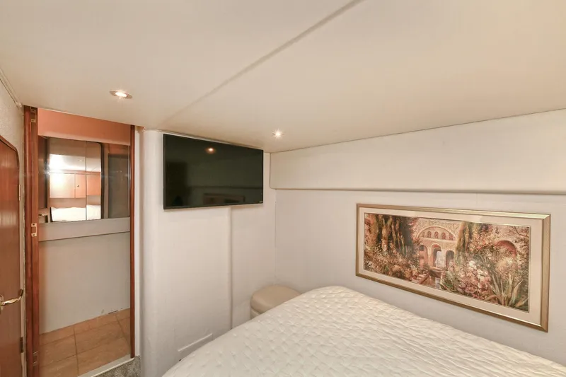 Slide: The Image of Interior of 2001 Ocean Yachts 52 Super Sport with bed and artwork. - 45