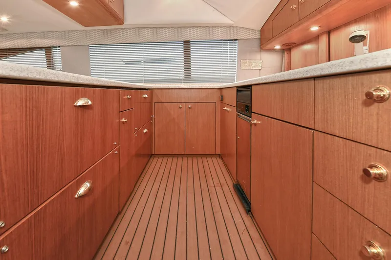 Slide: The Image of Interior of 2001 Ocean Yachts 52 Super Sport with wooden cabinetry. - 38