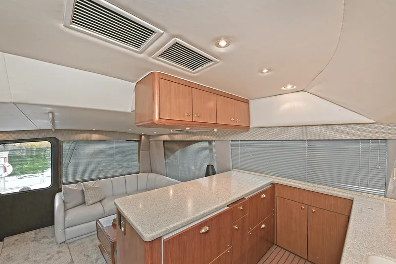 Slide: The Image of Interior of 2001 Ocean Yachts 52 Super Sport, featuring modern kitchen. - 34
