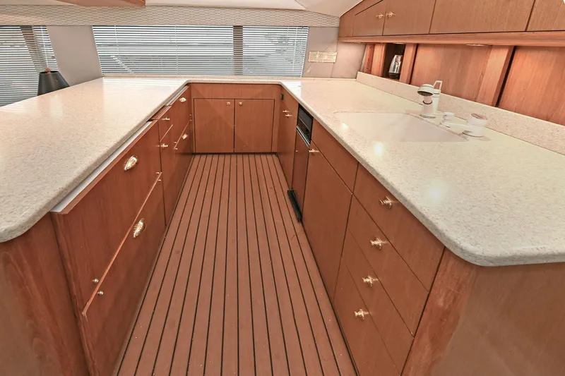 Slide: The Image of Interior of 2001 Ocean Yachts 52 Super Sport with wood flooring and countertops. - 37