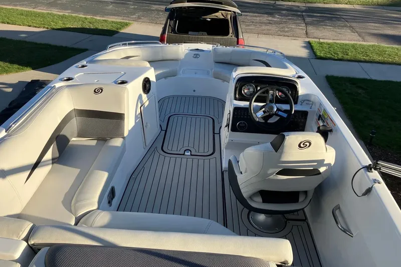 Slide: The Image of 2020 Hurricane SunDeck Sport 188 IO boat interior with steering wheel and seating. - 7
