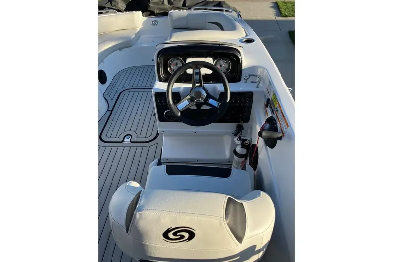 Slide: The Image of 2020 Hurricane SunDeck Sport 188 IO boat interior with steering wheel and dashboard controls. - 6