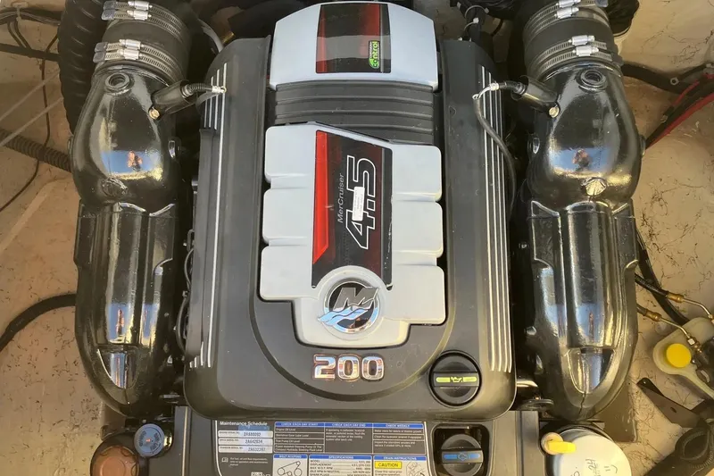 Slide: The Image of Engine of a 2020 Hurricane SunDeck Sport 188 IO boat, featuring a MerCruiser 4.5L 200 HP. - 17